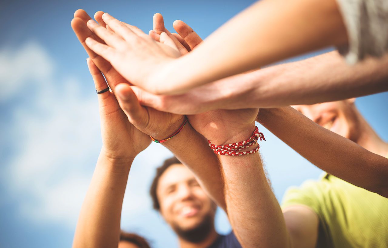 Charity donors high five