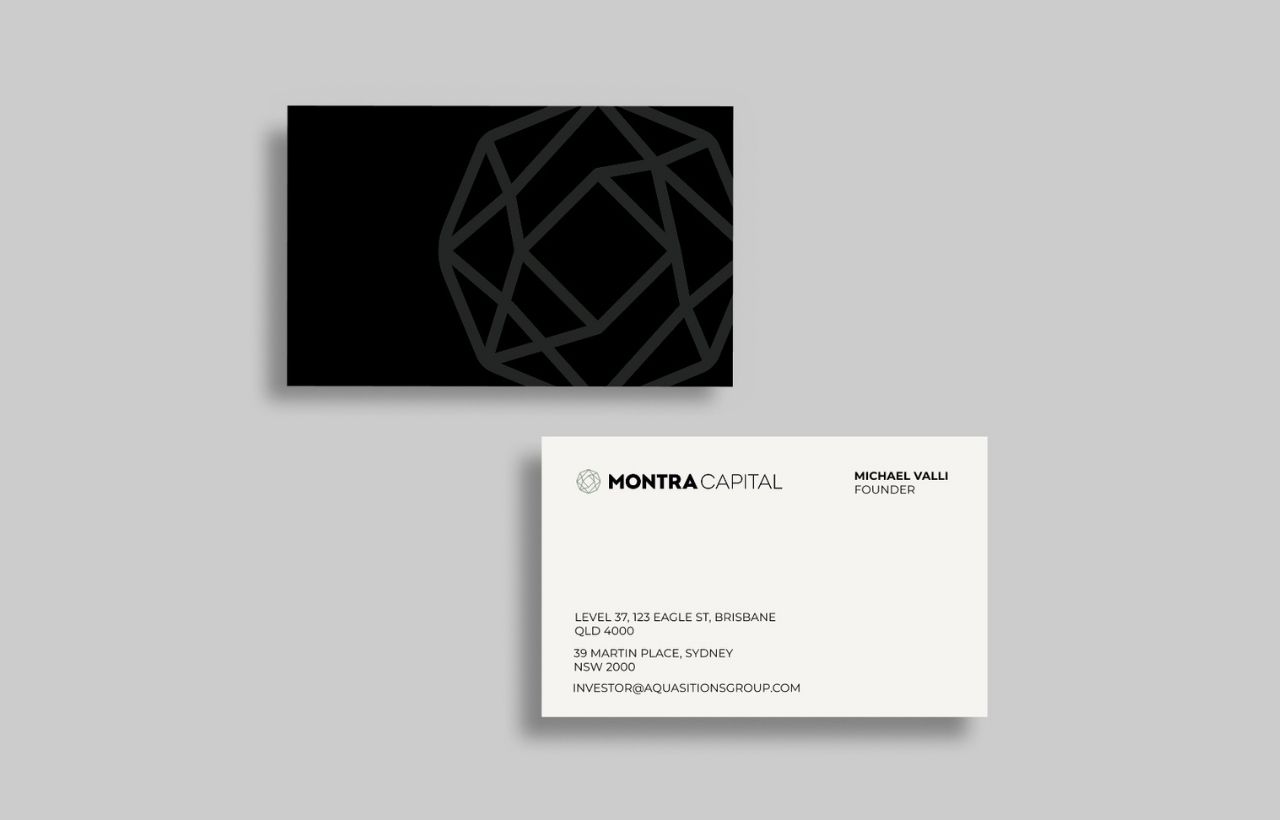 Montra Mockups - Business Cards 2 Two business cards are shown: one with a geometric pattern on a black background, the other with Montra Capital details and contact information on a white background.